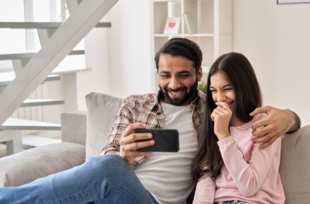 Father speaking to his daughter about online safety